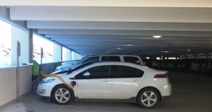 OU's new parking garage features plug-in chargers for electric car users. The car seen here is a Chevy Volt.